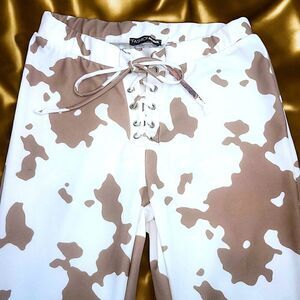 Fashion Nova brown white cow pattern flare pants